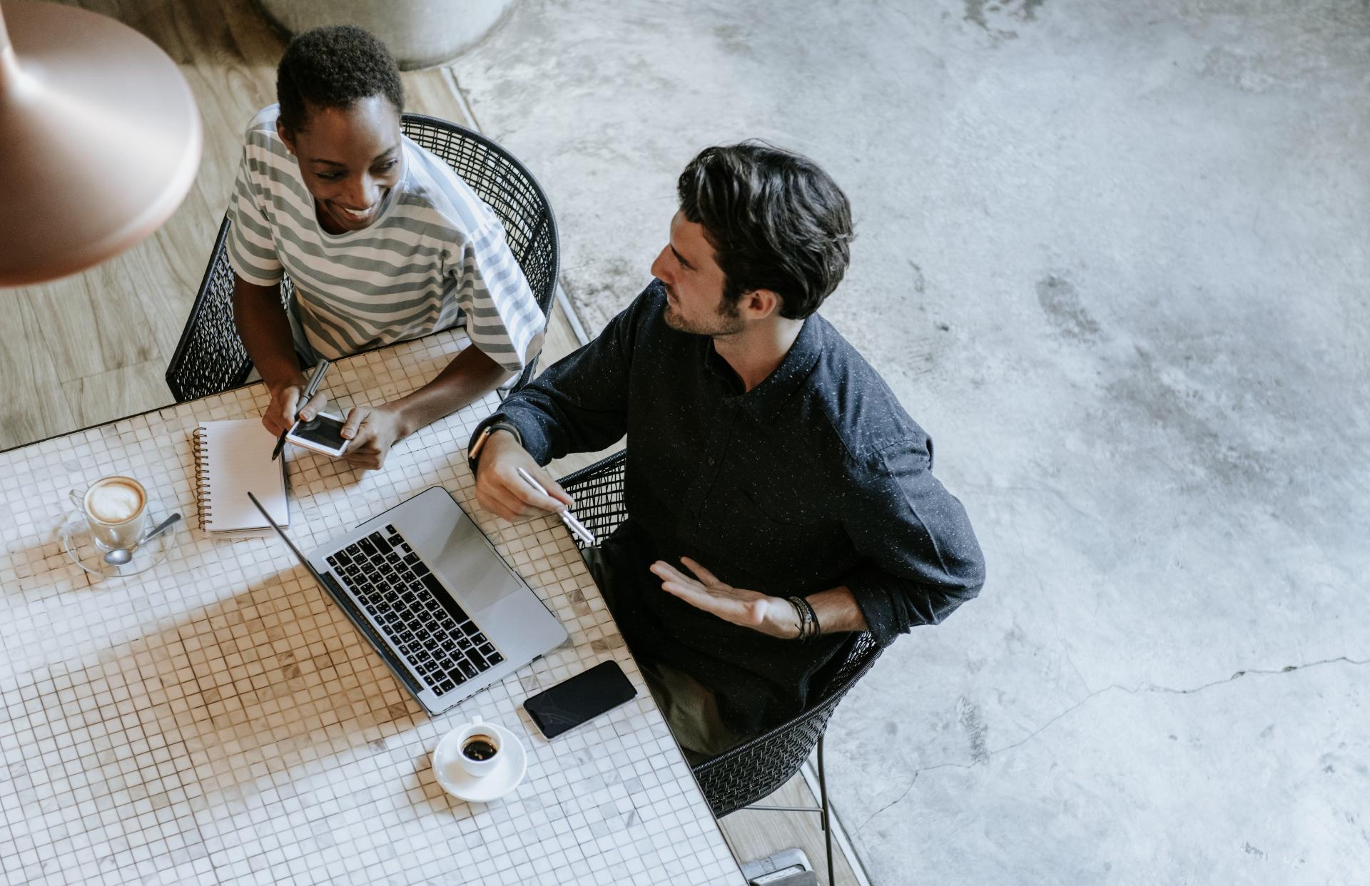 Colleagues Discussing Their Work Laptop